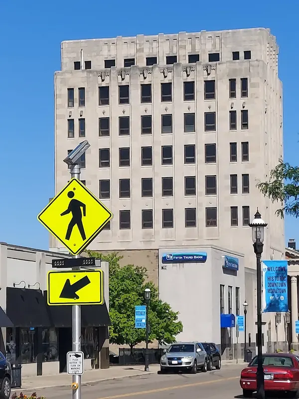 Tall office tower in downtown Middletown with blue street banners