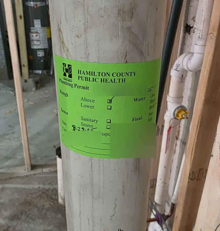 Hamilton County Public Health plumbing permit tag marked approved on a new drain stack