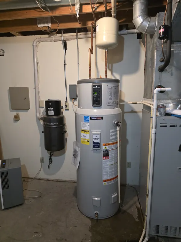 Heat pump hybrid water heater installed in a basement