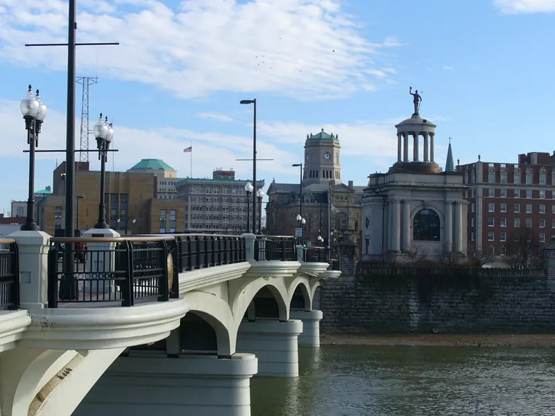High Street bridge over the Great Miami River in downtown Hamilton with the Soldiers, Sailors and Pioneers Monument and a clock tower