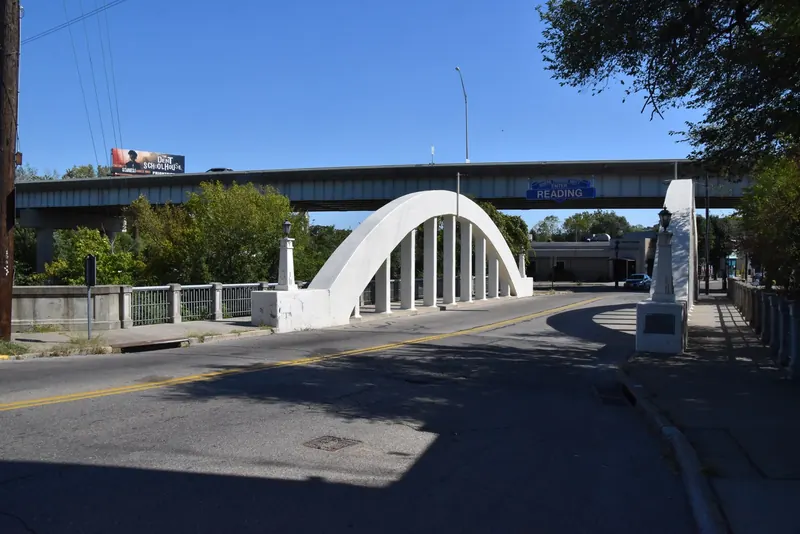 Historic white concrete arch bridge in Lockland