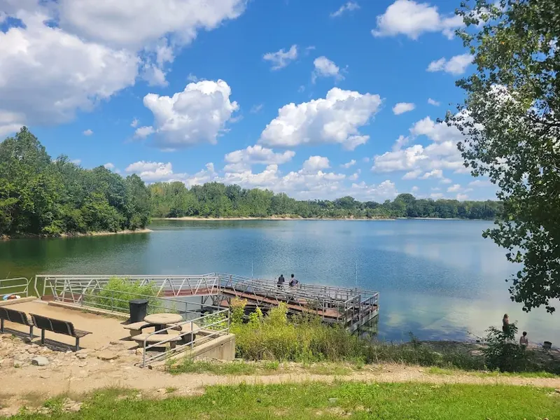 Marsh Lake with a wooden fishing pier under a blue sky in Fairfield
