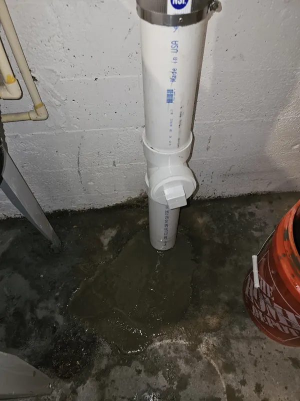 New PVC drain stack with a cleanout fitting at the basement floor