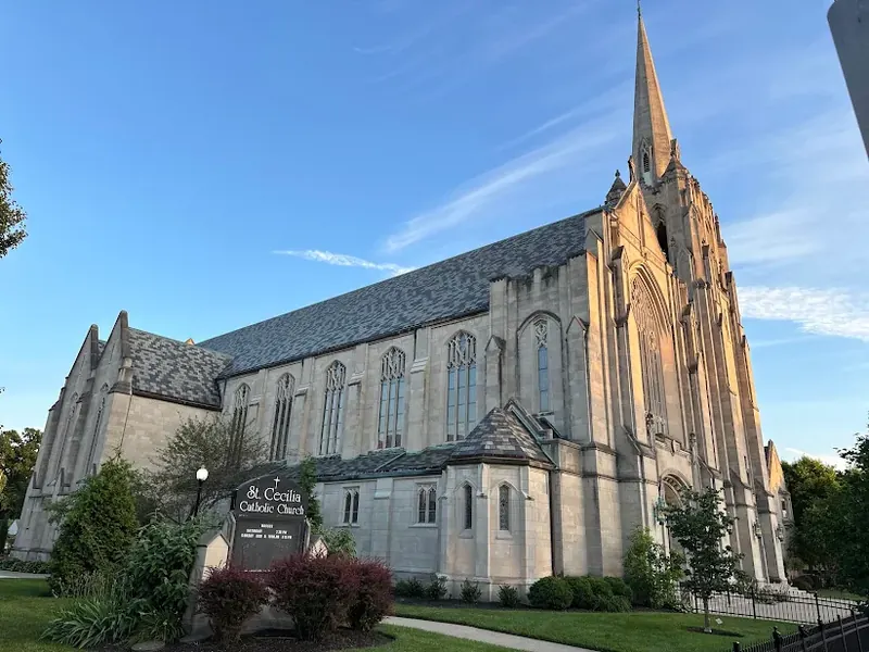 St. Cecilia Catholic Church, a stone Gothic church with a tall spire, in Oakley