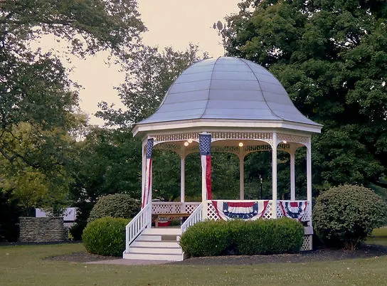 White domed gazebo decorated with red, white and blue bunting in Terrace Park