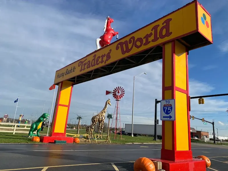 Yellow and red 'Hurry Back to Traders World' arch in Monroe