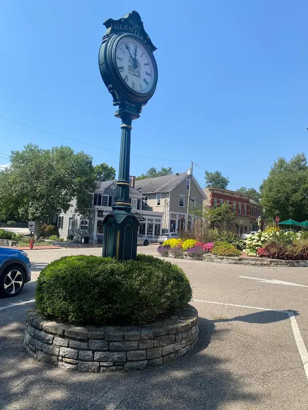 Village of Glendale street clock on a flower-lined island in the village square