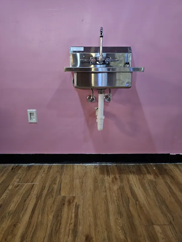 Wall-mounted stainless hand sink with new supply and drain