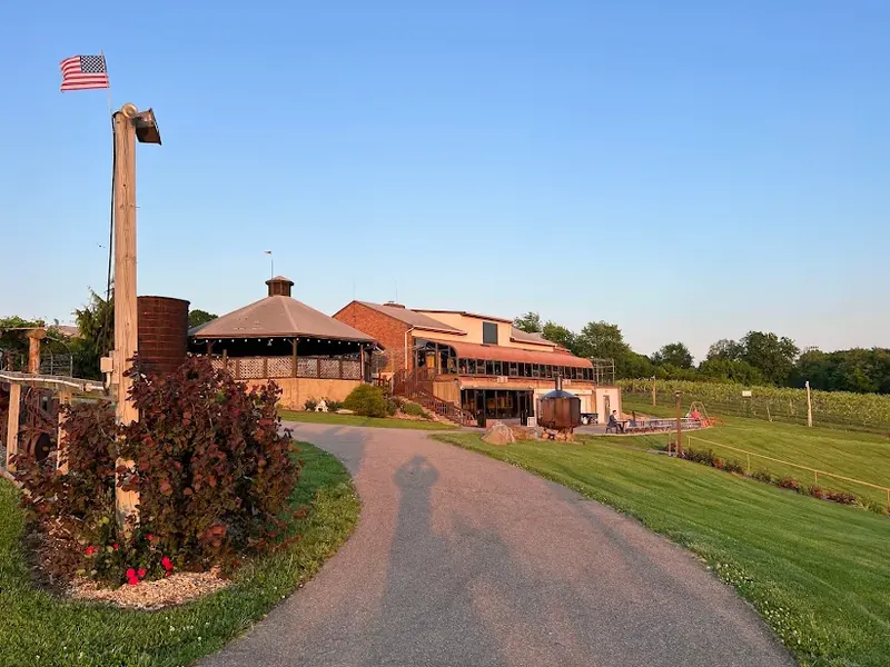 Winery building and vineyard in Colerain Township at sunset